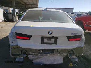 2020 BMW 3 Series 330i with VIN WBA5R1C02LFH48666, listed as a Copart auction lot 67959402 with 57,074 mi miles. Bid and sale history available at carsss.com. Image 6.