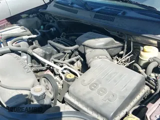 1999 Jeep Grand Cherokee Laredo z VIN 1J4G258S1XC787362, wystawiony jako IAAI lot #42931267 z przebiegiem 131 512 mil mil oraz . Historia ofert i sprzedaży dostępna na DreamBid. Obrazek 13.