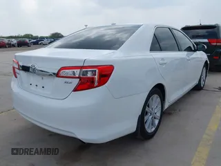 2014 Toyota Camry SE with VIN 4T1BK1FK5EU551196, listed as a IAAI auction lot 41912297 with 104,445 mi miles. Bid and sale history available at carsss.com. Image 4.