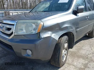 2011 Honda Pilot EX-L with VIN 5FNYF4H51BB065906, listed as a IAAI auction lot 41956370 with 233,977 mi miles and . Bid and sale history available at DreamBid. Image 6.
