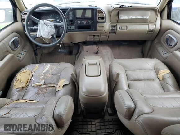 1998 Chevrolet Tahoe z VIN 3GNEK18R6WG102052, wystawiony jako Copart lot #77485244 z przebiegiem 187 542 mil mil oraz Szkoda całkowita • Salvage title. Historia ofert i sprzedaży dostępna na DreamBid. Obrazek 8.