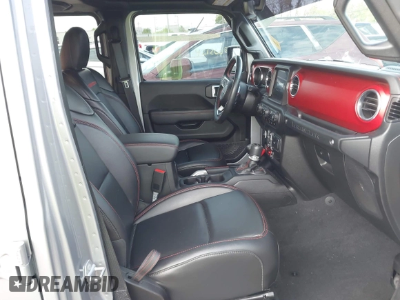 2021 Jeep Wrangler Unlimited Rubicon with VIN 1C4HJXFNXMW560512, listed as a IAAI auction lot 42124812 with 18,034 mi miles and . Bid and sale history available at DreamBid. Image 5.