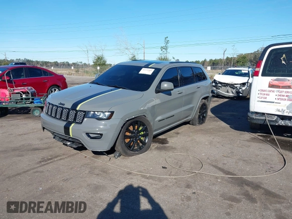 2021 Jeep Grand Cherokee Laredo E with VIN 1C4RJEAG3MC713511, listed as a IAAI auction lot 41235904 with 73,343 mi miles and . Bid and sale history available at DreamBid. Image 2.