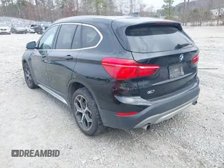 2017 BMW X1 sDrive28i with VIN WBXHU7C36HP924874, listed as a IAAI auction lot 41368396 with 113,443 mi miles. Bid and sale history available at carsss.com. Image 3.
