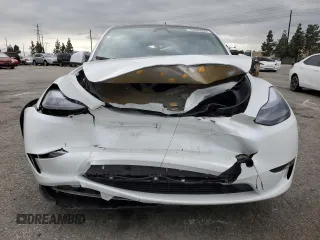 2024 Tesla Model Y Long Range with VIN 7SAYGDEE8RF088808, listed as a Copart auction lot 50406865 with 8,150 mi miles and Salvage title. Bid and sale history available at DreamBid. Image 5.
