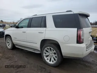 2016 GMC Yukon Denali with VIN 1GKS2CKJ4GR196335, listed as a Copart auction lot 47566265 with 105,970 mi miles and Salvage Title. Bid and sale history available at carsss.com. Image 2.