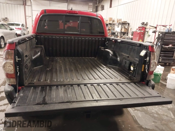2015 Toyota Tacoma with VIN 3TMLU4EN3FM196518, listed as a IAAI auction lot 41198481 with 96,277 mi miles and . Bid and sale history available at DreamBid. Image 13.