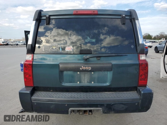 2006 Jeep Commander with VIN 1J8HH48N46C133122, listed as a Copart auction lot 80821094 with 216,412 mi miles and Salvage Title. Bid and sale history available at carsss.com. Image 6.