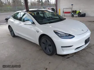 2020 Tesla Model 3 Standard Range Plus with VIN 5YJ3E1EA3LF740380, listed as a IAAI auction lot 41944372 with 44,148 mi miles. Bid and sale history available at carsss.com. Image 1.