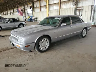 2000 Jaguar XJ with VIN SAJDA25B8YMF04079, listed as a Copart auction lot 50592595 with 131,647 mi miles and Salvage title. Bid and sale history available at DreamBid. Image 1.