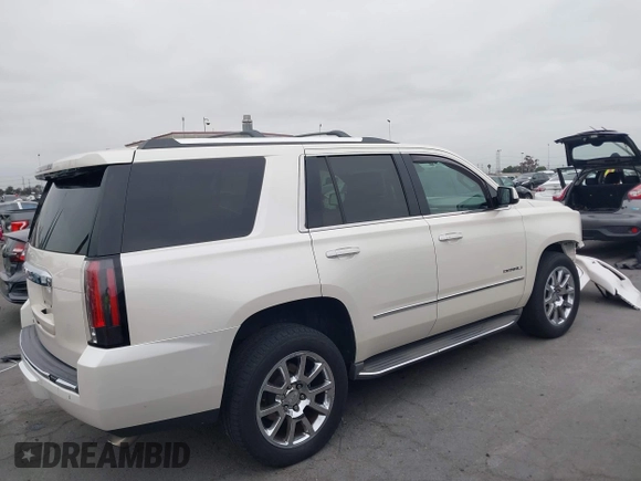 2015 GMC Yukon Denali with VIN 1GKS2CKJ9FR294551, listed as a IAAI auction lot 42162654 with 106,063 mi miles. Bid and sale history available at carsss.com. Image 14.