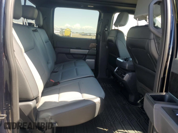 2023 Ford F-150 Lightning Pro z VIN 1FT6W1EV0PWG28960, wystawiony jako Copart lot #51858855 z przebiegiem Nie podano mil oraz Nie do naprawy • Non repairable. Historia ofert i sprzedaży dostępna na DreamBid. Obrazek 10.