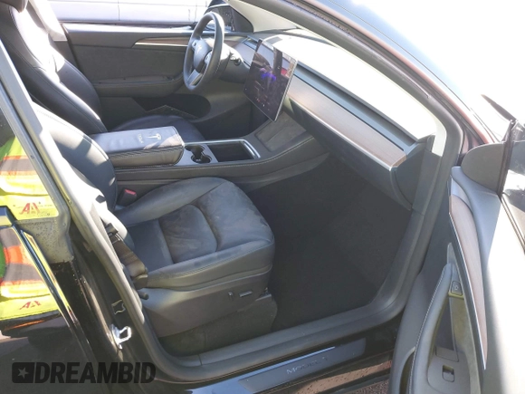2023 Tesla Model Y Performance with VIN 7SAYGDEF6PF854797, listed as a IAAI auction lot 41319332 with 46,132 mi miles and . Bid and sale history available at DreamBid. Image 5.