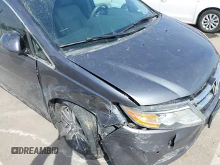 2014 Honda Odyssey Touring with VIN 5FNRL5H91EB093540, listed as a IAAI auction lot 41887412 with 202,076 mi miles and . Bid and sale history available at DreamBid. Image 21.