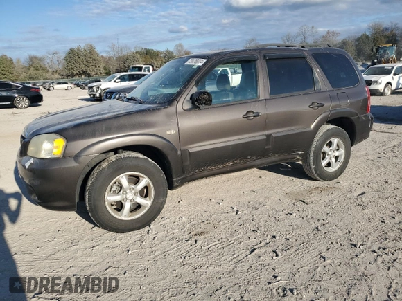 2006 Mazda Tribute S with VIN 4F2YZ04116KM23873, listed as a Copart auction lot 79926084 with 67,142 mi miles and Salvage Title. Bid and sale history available at DreamBid. Image 1.