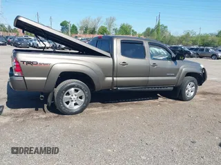 2015 Toyota Tacoma with VIN 3TMMU4FN5FM082376, listed as a IAAI auction lot 42144113 with 98,244 mi miles and . Bid and sale history available at DreamBid. Image 4.