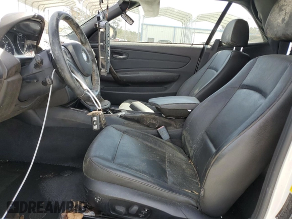 2010 BMW 1 Series 128i with VIN WBAUN1C5XAVH81789, listed as a Copart auction lot 49798465 with 128,859 mi miles and Clean title. Bid and sale history available at DreamBid. Image 7.