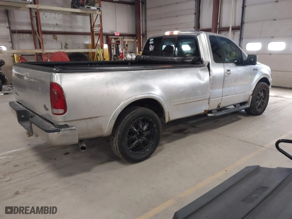 2005 Ford F-150 XL with VIN 1FTRF12W15NA18935, listed as a IAAI auction lot 41942570 with 152,708 mi miles. Bid and sale history available at carsss.com. Image 4.