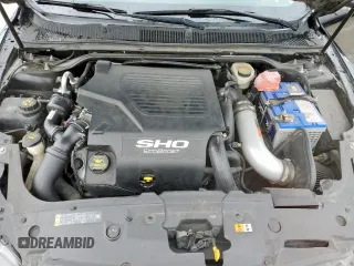 2014 Ford Taurus SHO z VIN 1FAHP2KT4EG106957, wystawiony jako Copart lot #59364185 z przebiegiem 113 704 mil mil oraz Szkoda całkowita • Salvage title. Historia ofert i sprzedaży dostępna na DreamBid. Obrazek 11.