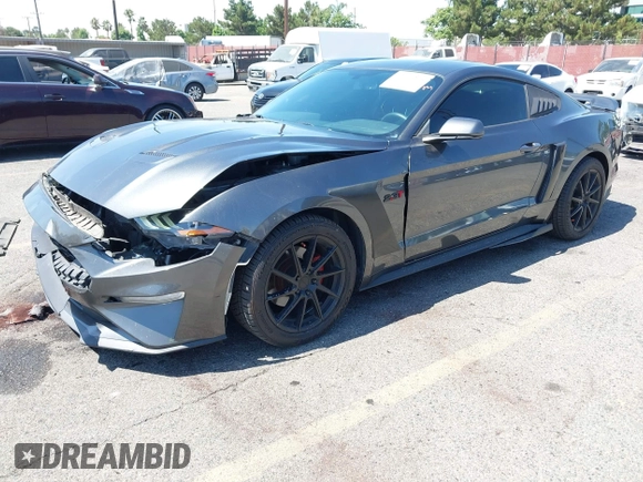 2019 Ford Mustang EcoBoost with VIN 1FA6P8TH5K5181274, listed as a IAAI auction lot 42719275 with 91,605 mi miles and . Bid and sale history available at DreamBid. Image 2.