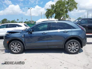 2019 Cadillac XT4 FWD Sport with VIN 1GYFZER42KF107032, listed as a IAAI auction lot 42193557 with 96,615 mi miles and . Bid and sale history available at DreamBid. Image 14.