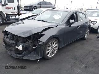 2014 Mazda 3 s Touring with VIN JM1BM1L35E1208952, listed as a IAAI auction lot 42121077 with 183,985 mi miles. Bid and sale history available at carsss.com. Image 2.