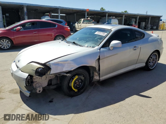 2006 Hyundai Tiburon GT z VIN KMHHN65F26U225506, wystawiony jako Copart lot #56997285 z przebiegiem 170 175 mil mil oraz Szkoda całkowita • Salvage title. Historia ofert i sprzedaży dostępna na DreamBid. Obrazek 1.