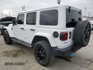 2023 Jeep Wrangler Sahara with VIN 1C4JJXP63PW536694, listed as a Copart auction lot 63409845 with 32,560 mi miles and Salvage title. Bid and sale history available at DreamBid. Image 2.
