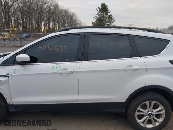 2018 Ford Escape SE z VIN 1FMCU9GD2JUC77186, wystawiony jako IAAI lot #41308133 z przebiegiem 123 156 mil mil oraz . Historia ofert i sprzedaży dostępna na DreamBid. Obrazek 14.