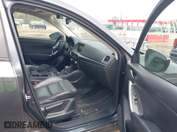 2016 Mazda CX-5 Grand Touring with VIN JM3KE4DYXG0830150, listed as a IAAI auction lot 41961007 with 142,570 mi miles and . Bid and sale history available at DreamBid. Image 5.