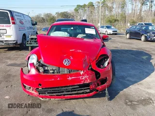 2013 Volkswagen Beetle Fender Edition z VIN 3VWJP7AT8DM674981, wystawiony jako IAAI lot #41685176 z przebiegiem 65 283 mil mil oraz . Historia ofert i sprzedaży dostępna na DreamBid. Obrazek 13.