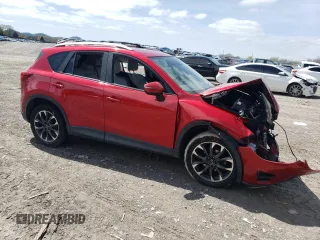 2016 Mazda CX-5 Grand Touring with VIN JM3KE2DY5G0692554, listed as a Copart auction lot 51322475 with 128,086 mi miles and Salvage Title. Bid and sale history available at carsss.com. Image 4.