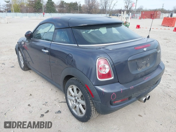 2013 MINI Coupe S with VIN WMWSX3C50DT466882, listed as a IAAI auction lot 42026938 with 99,499 mi miles and . Bid and sale history available at DreamBid. Image 3.