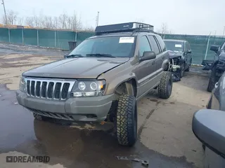 2002 Jeep Grand Cherokee Laredo with VIN 1J4GW48N12C193792, listed as a IAAI auction lot 41545283 with 166,720 mi miles. Bid and sale history available at carsss.com. Image 2.