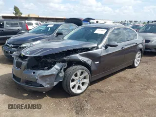 2007 BMW 3 Series 335xi with VIN WBAVD53577A006071, listed as a IAAI auction lot 41924859 with 128,693 mi miles. Bid and sale history available at carsss.com. Image 2.