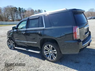 2015 GMC Yukon Denali with VIN 1GKS2CKJ5FR612147, listed as a Copart auction lot 49209525 with 127,262 mi miles and Salvage Title. Bid and sale history available at carsss.com. Image 2.