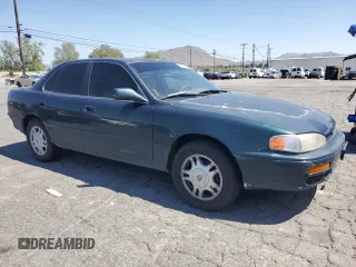 1995 Toyota Camry LE with VIN JT2GK12EXS0123355, listed as a Copart auction lot 53195364 with 171,510 mi miles and Salvage Title. Bid and sale history available at carsss.com. Image 4.