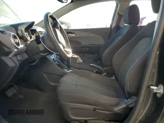 2014 Chevrolet Sonic LT with VIN 1G1JC5SH7E4220059, listed as a Copart auction lot 49877765 with 136,896 mi miles and Salvage Title. Bid and sale history available at DreamBid. Image 7.