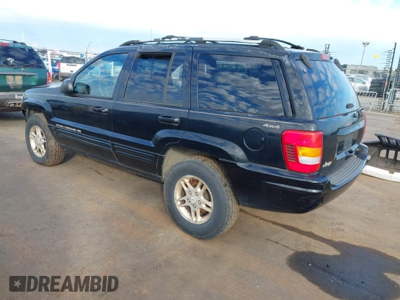 1999 Jeep Grand Cherokee Limited with VIN 1J4GW68NXXC637464, listed as a IAAI auction lot 41561690 with 235,728 mi miles. Bid and sale history available at carsss.com. Image 3.