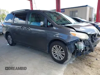 2014 Toyota Sienna XLE with VIN 5TDYK3DC0ES440355, listed as a IAAI auction lot 42762012 with 200,216 mi miles and . Bid and sale history available at DreamBid. Image 1.