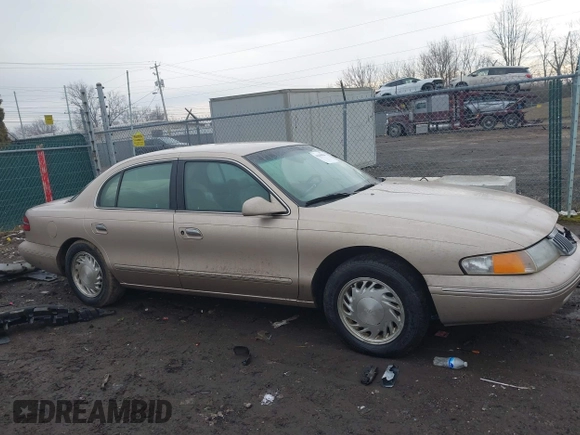 1997 Lincoln Continental with VIN 1LNLM97V3VY666104, listed as a IAAI auction lot 41650904 with 181,536 mi miles. Bid and sale history available at carsss.com. Image 13.