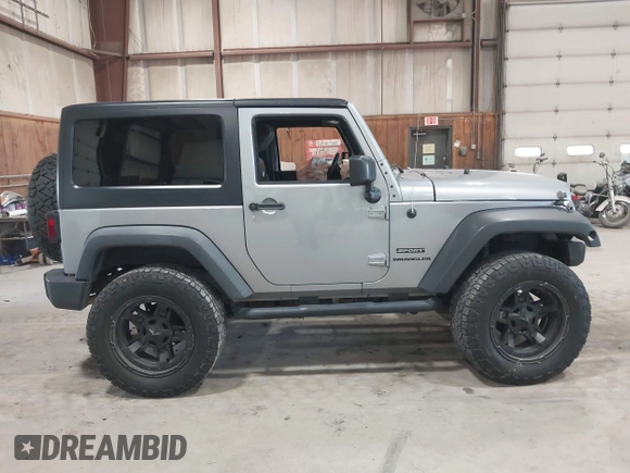 2014 Jeep Wrangler Sport with VIN 1C4AJWAG0EL173362, listed as a IAAI auction lot 42231863 with 99,321 mi miles and . Bid and sale history available at DreamBid. Image 13.