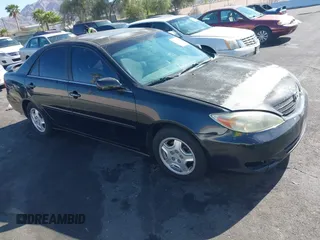 2002 Toyota Camry XLE z VIN 4T1BF32KX2U029701, wystawiony jako IAAI lot #42088655 z przebiegiem 245 807 mil mil oraz . Historia ofert i sprzedaży dostępna na DreamBid. Obrazek 1.