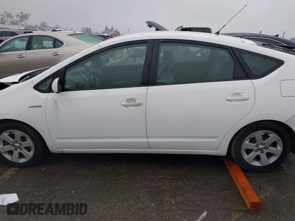 2007 Toyota Prius z VIN JTDKB20U177622142, wystawiony jako IAAI lot #41720920 z przebiegiem 140 665 mil mil oraz . Historia ofert i sprzedaży dostępna na DreamBid. Obrazek 14.