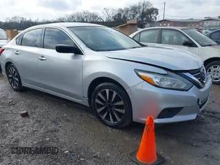 2016 Nissan Altima SV with VIN 1N4AL3AP0GC262897, listed as a IAAI auction lot 41063385 with 157,331 mi miles and . Bid and sale history available at DreamBid. Image 1.
