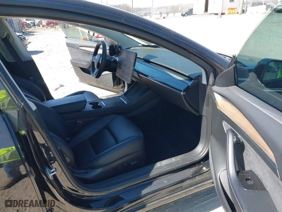 2022 Tesla Model 3 Long Range with VIN 5YJ3E1EB2NF174028, listed as a IAAI auction lot 41697310 with NaN miles. Bid and sale history available at carsss.com. Image 5.