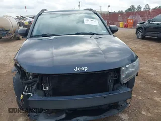 2014 Jeep Compass Sport with VIN 1C4NJCBA1ED725875, listed as a IAAI auction lot 42118863 with 133,136 mi miles. Bid and sale history available at carsss.com. Image 6.
