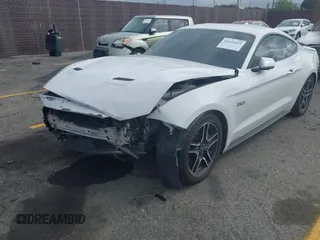 2021 Ford Mustang GT with VIN 1FA6P8CF5M5115597, listed as a IAAI auction lot 42142619 with 101,687 mi miles and . Bid and sale history available at DreamBid. Image 2.