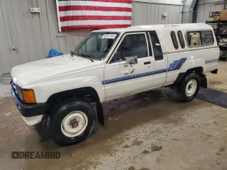 1986 Toyota Pickup с VIN JT4RN67D8G5039713, выставлен на аукционе Copart как лот 52261765 с пробегом 97 961 миль миль и Чистый • Clean title. История ставок и продаж доступна на DreamBid. Изображение 1.