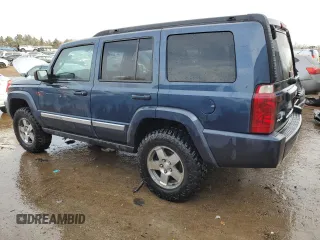 2010 Jeep Commander Sport with VIN 1J4RG4GK5AC119433, listed as a Copart auction lot 87657265 with 212,973 mi miles and Salvage title. Bid and sale history available at DreamBid. Image 2.